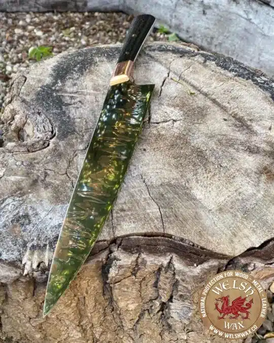 Jamie Nerkowski custom made knife on log